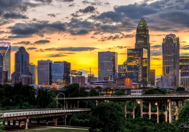 A view of the city skyline at sunset.