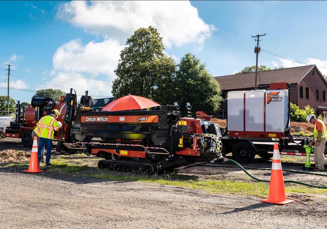 A construction crew working on the side of a truck.